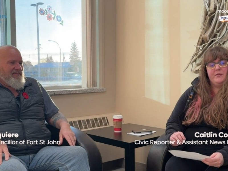 Two people smiling at the camera