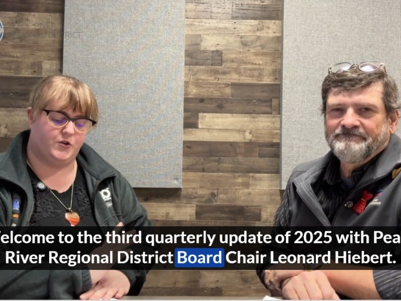 Two people smiling at the camera