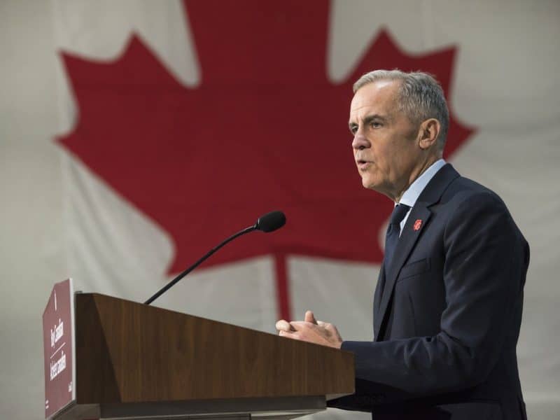 Prime Minister Mark Carney makes an announcement at the manufacturing facility of Maple Leaf Homes in Fredericton on Monday, November 10th, 2025. (THE CANADIAN PRESS/Stephen MacGillivray)