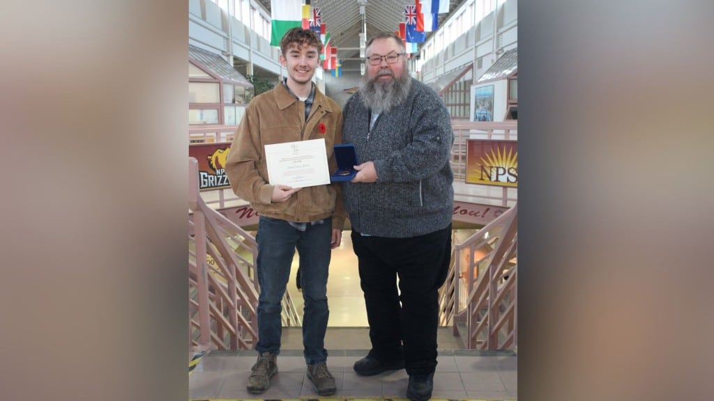 Current image: Former NPSS student Krispin Johnson (left) receives the Governor General's Medal from School principal Todd Koponyas (Photo submitted by Colette Roy)