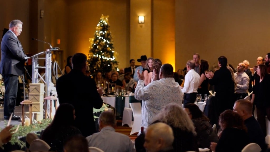 Jim Reeder, FSJ Hospital Foundation board member on stage at the Be an Angel Gala in 2025. (Sound in Town)