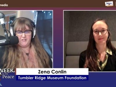 Two people smiling at the camera