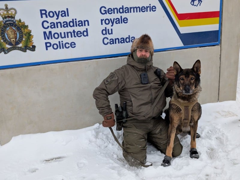 Police service dog Mako and his handler in the snow in Fort St. John. (Fort St. John RCMP)
