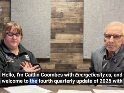 Two people smiling at the camera