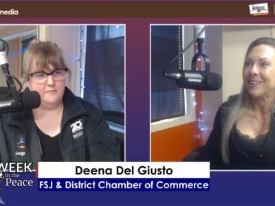 Two people smiling at the camera