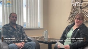 Two people smiling at the camera