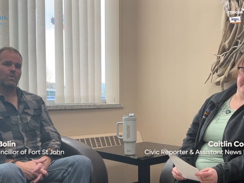 Two people smiling at the camera