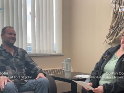 Two people smiling at the camera