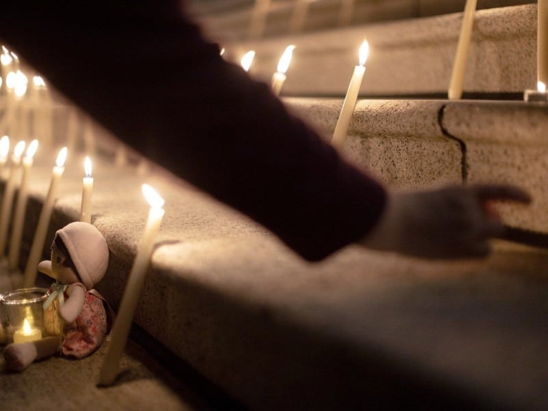 People attend a candle light vigil at the front steps of the legislature in Victoria, B.C., on Wednesday, Feb. 11, 2026 in honour of the victims of the school shooting in Tumbler Ridge, B.C. THE CANADIAN PRESS/Chad Hipolito CHAD HIPOLITO
