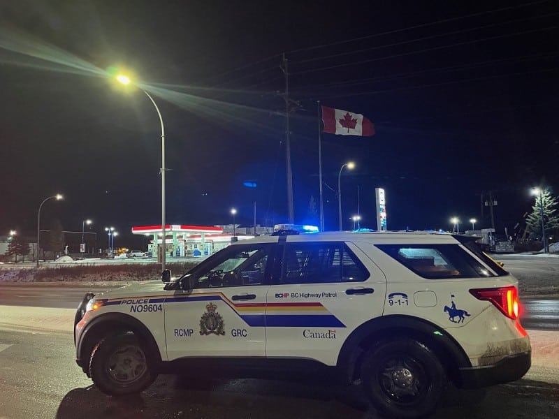 A BC Highway Patrol cruiser parked roadside in slushy, winter conditions near Prince George