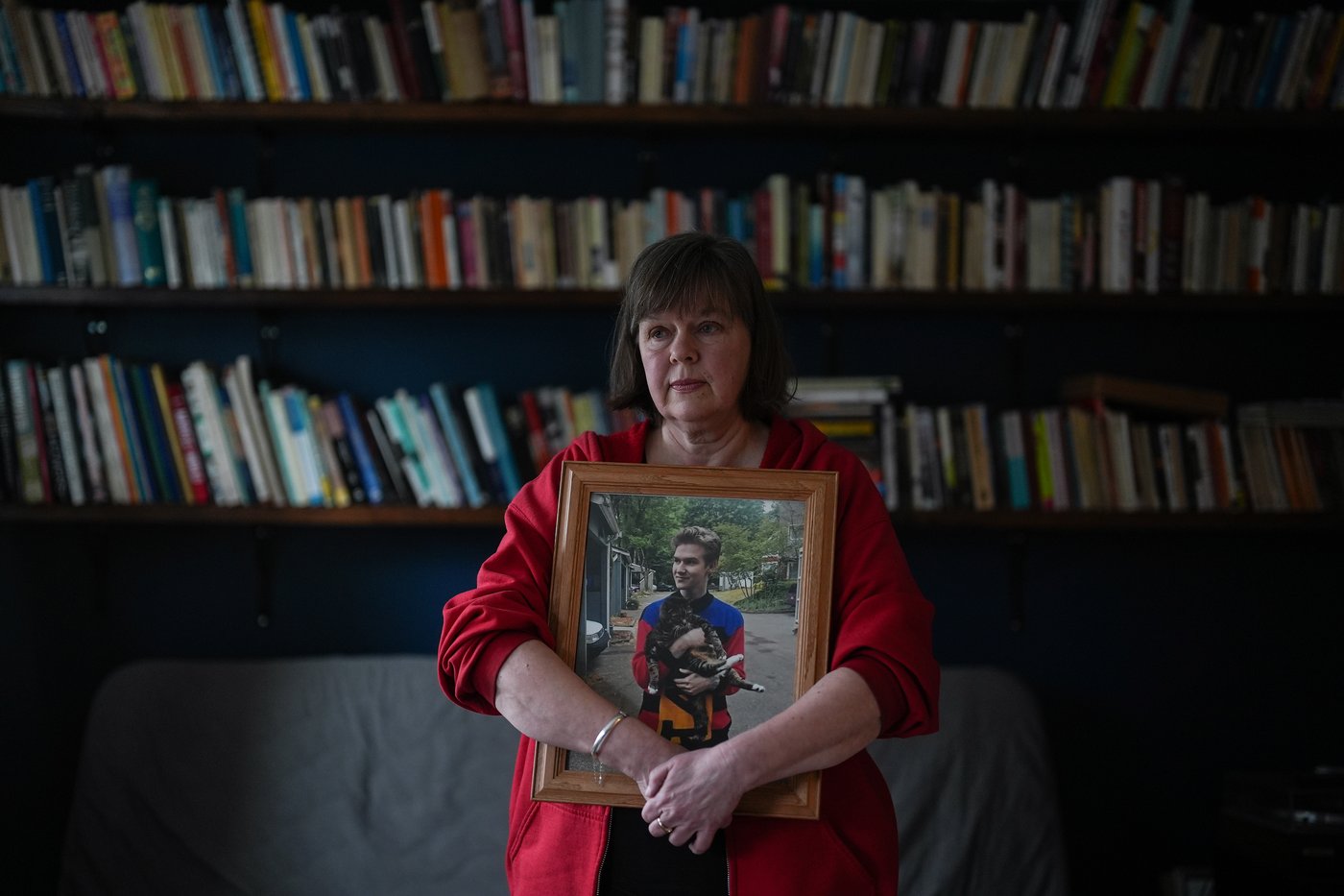 Maria Rantanen holds a photo of her late son Michael Rantanen, who died of a fentanyl overdose in 2022 at the age of 25, while posing for a photograph in Vancouver, on Wednesday, March 18, 2026. THE CANADIAN PRESS/Darryl Dyck