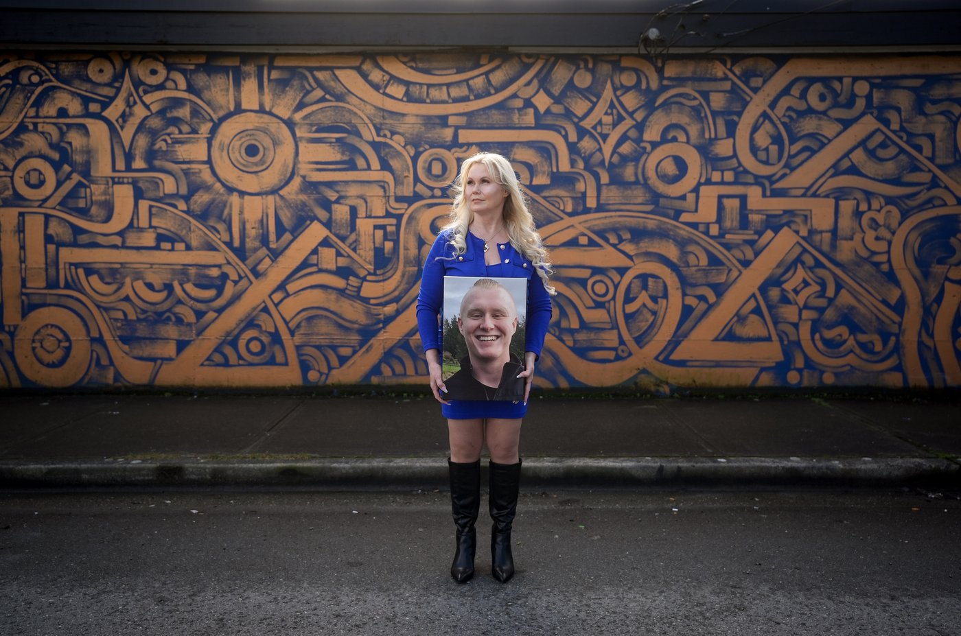 Michelle Jansen holds a photo of her late son, Brandon Jansen, who died of a fentanyl overdose at a rehab facility days before his 21st birthday in 2016, while posing for a photograph in Maple Ridge, B.C., on Friday, March 20, 2026. THE CANADIAN PRESS/Darryl Dyck