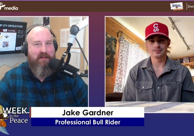 Two people smiling at the camera