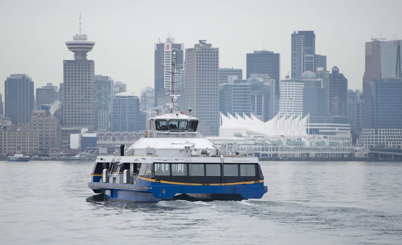 Downtown Vancouver is pictured in the background as a translink SeaBus leaves North Vancouver, B.C., Wednesday, Feb. 4, 2015. THE CANADIAN PRESS/Jonathan Hayward