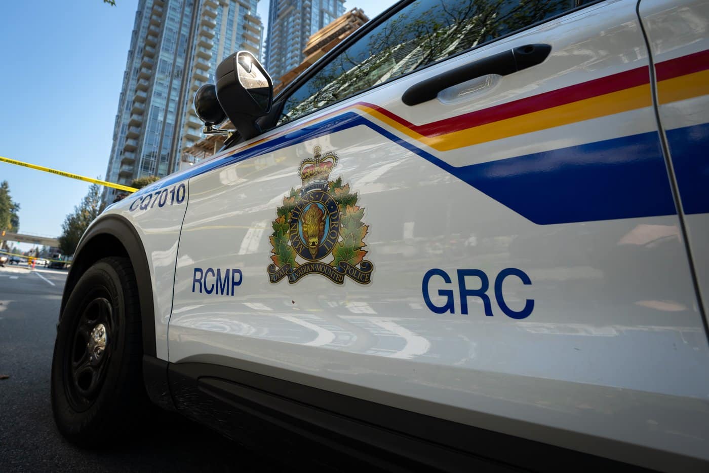 A RCMP vehicle in a roadblock is seen on Glen Drive after a shooting involving RCMP officers in Coquitlam B.C. on Friday, Sept. 22, 2023. THE CANADIAN PRESS/Ethan Cairns