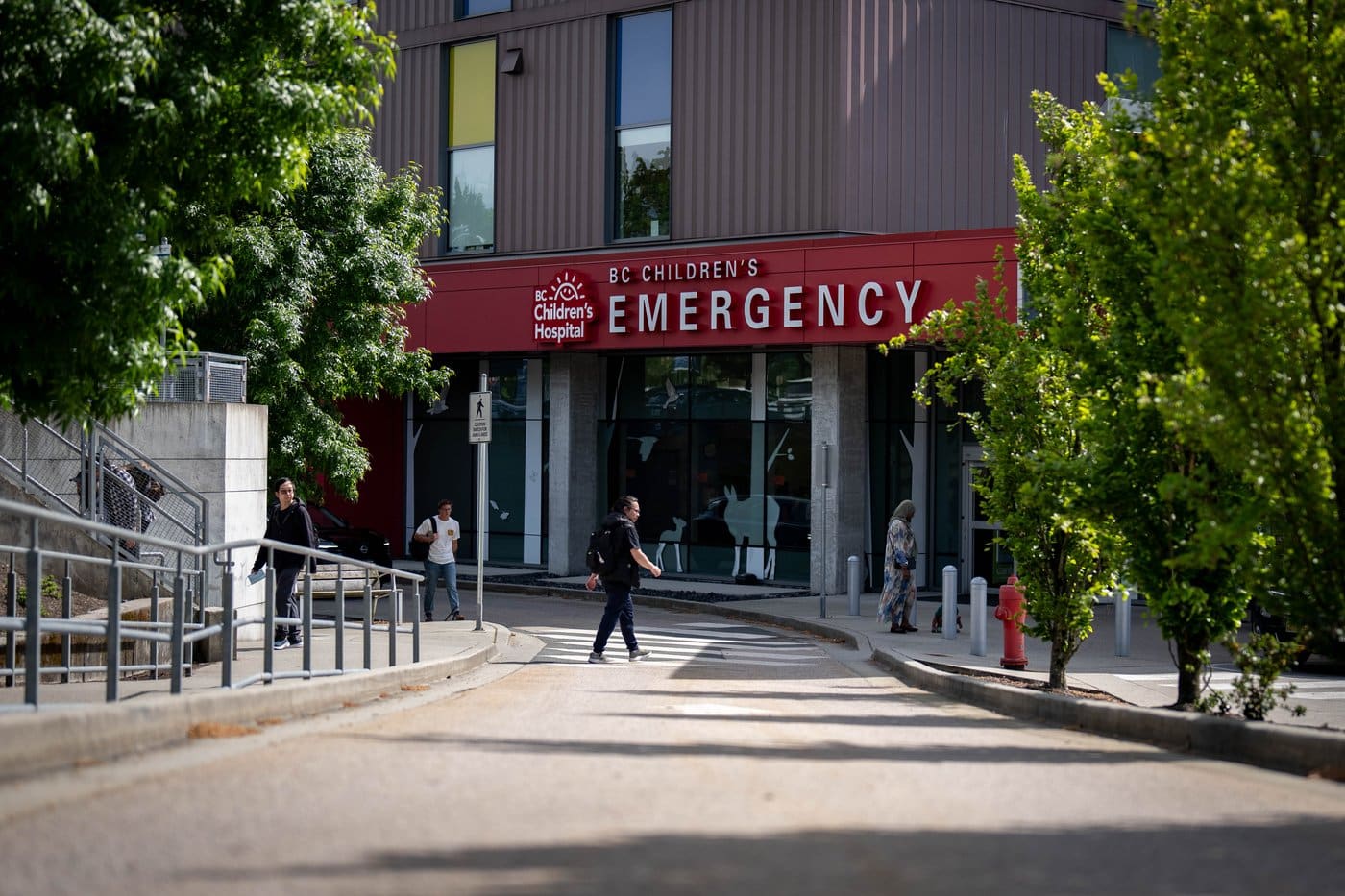 People walk past the emergency entrance to B.C. Children's Hospital in Vancouver, B.C., on Tuesday, May 12, 2026. THE CANADIAN PRESS/Ethan Cairns