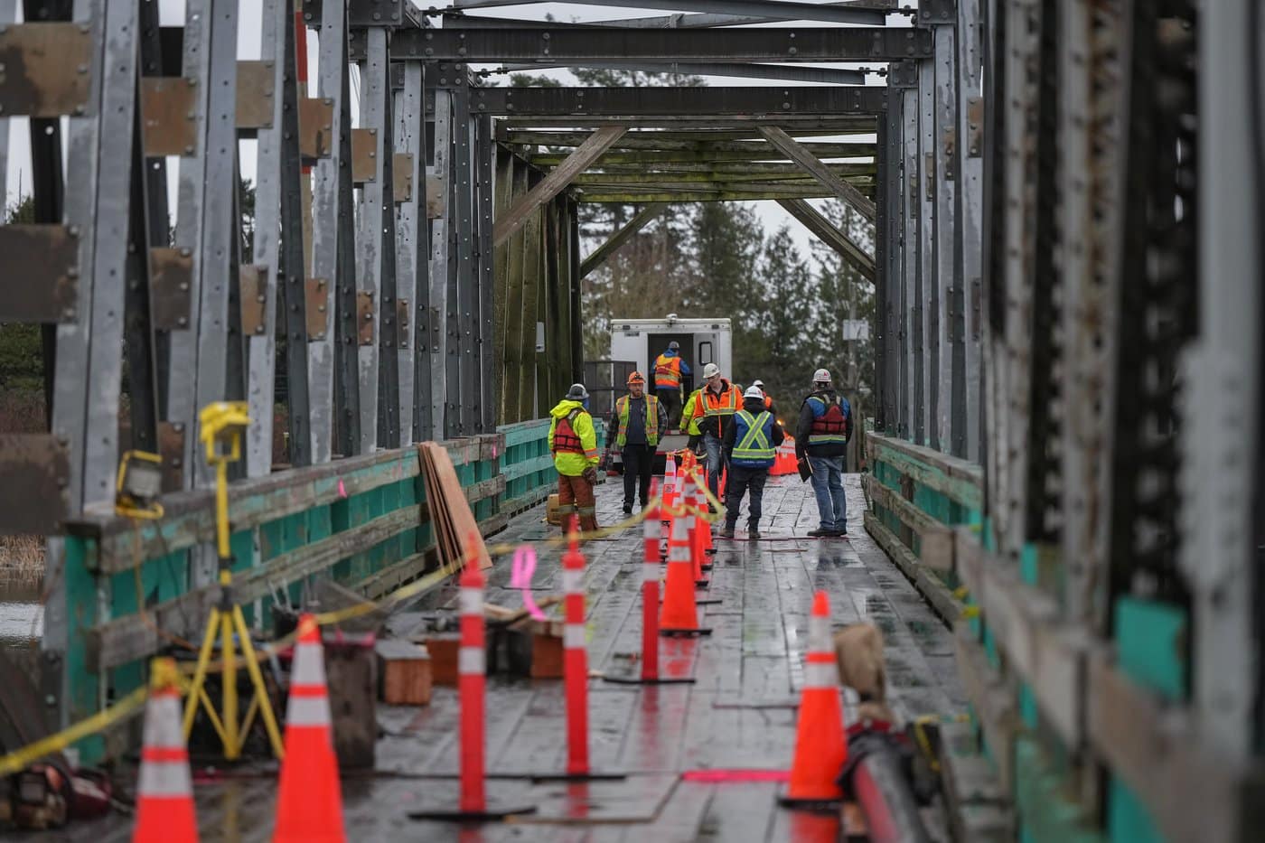 Workers gather on the Westham Island Bridge, which is closed to vehicle traffic after the span was hit by a tugboat, in Delta, B.C., on Wednesday, Jan. 28, 2026. THE CANADIAN PRESS/Darryl Dyck