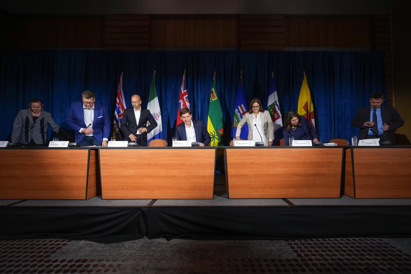 Western premiers take their seats for a news conference after meeting in Whistler, B.C., on Tuesday, June 27, 2023. THE CANADIAN PRESS/Darryl Dyck