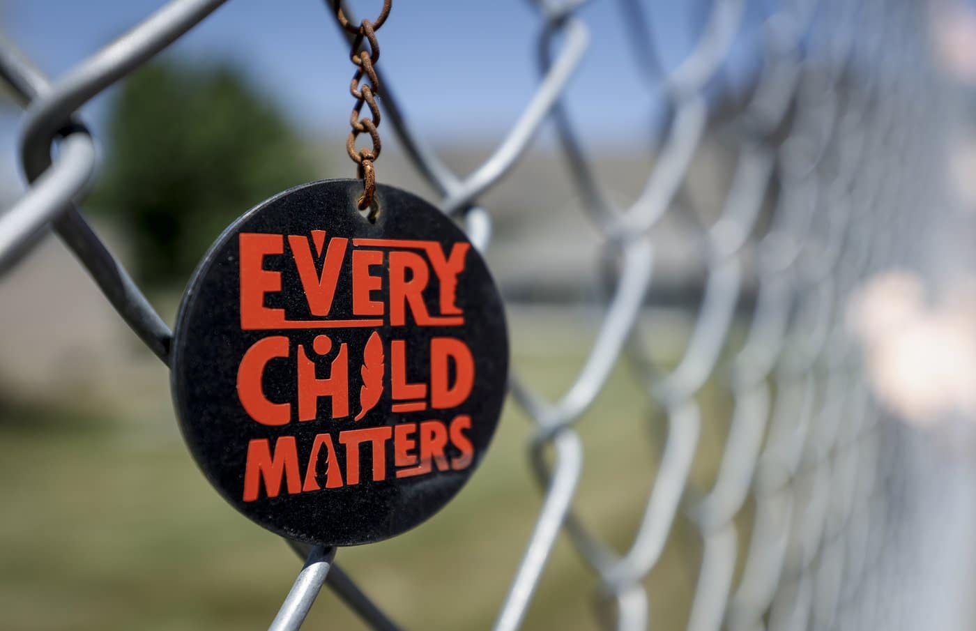 A key chain dangles from a fence as part of a memorial outside the former Kamloops Indian Residential School in Kamloops, B.C., Thursday, June 1, 2023. THE CANADIAN PRESS/Jeff McIntosh