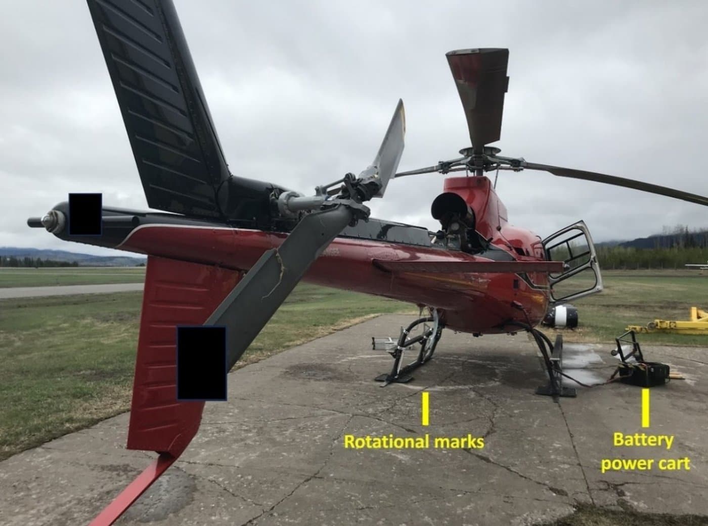A helicopter involved in a fatal accident at Smithers Airport in Smithers, B.C., on May 6, 2023, is shown in this handout photo from the Transportation Safety Board report on the accident. THE CANADIAN PRESS/Handout — TSB, Smithers RCMP (Mandatory Credit)