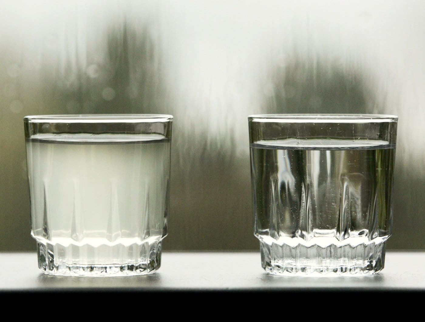 A glass of filtered water right, looks clear next to a glass of turbid tap water in North Vancouver, on Friday, Nov. 17, 2006. THE CANADIAN PRESS/Chuck Stoody