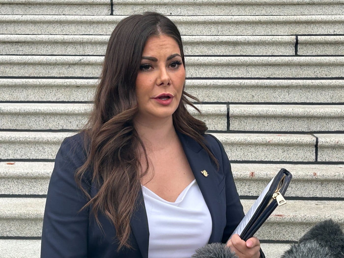 B.C. independent MLA Amelia Boultbee speaks outside the legislature in Victoria, Monday, Oct. 20, 2025. THE CANADIAN PRESS/Wolfgang Depner
