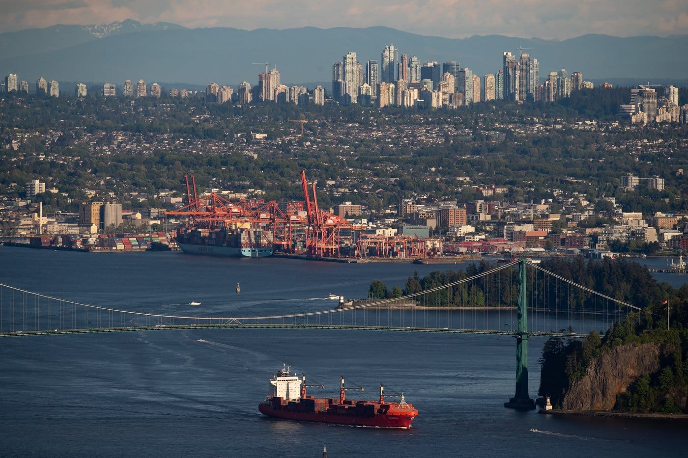 The container ship Ballenita passes under the Lions Gate Bridge after leaving port, in Vancouver, B.C., Monday, May 18, 2020. THE CANADIAN PRESS/Darryl Dyck