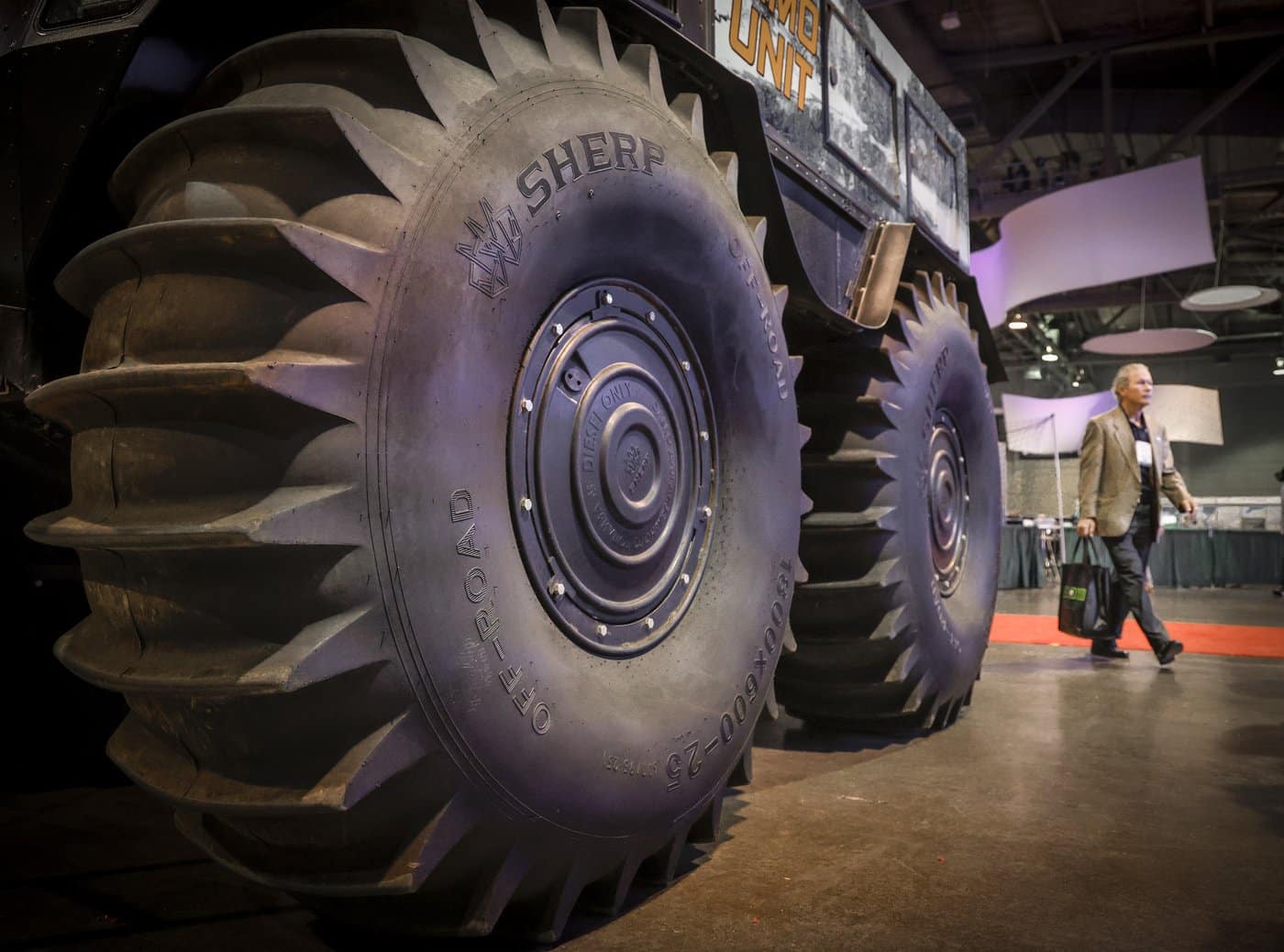 A delegate walks past an all-terrain vehicle at the Global Energy Show in Calgary on Tuesday, June 10, 2025. THE CANADIAN PRESS/Jeff McIntosh
