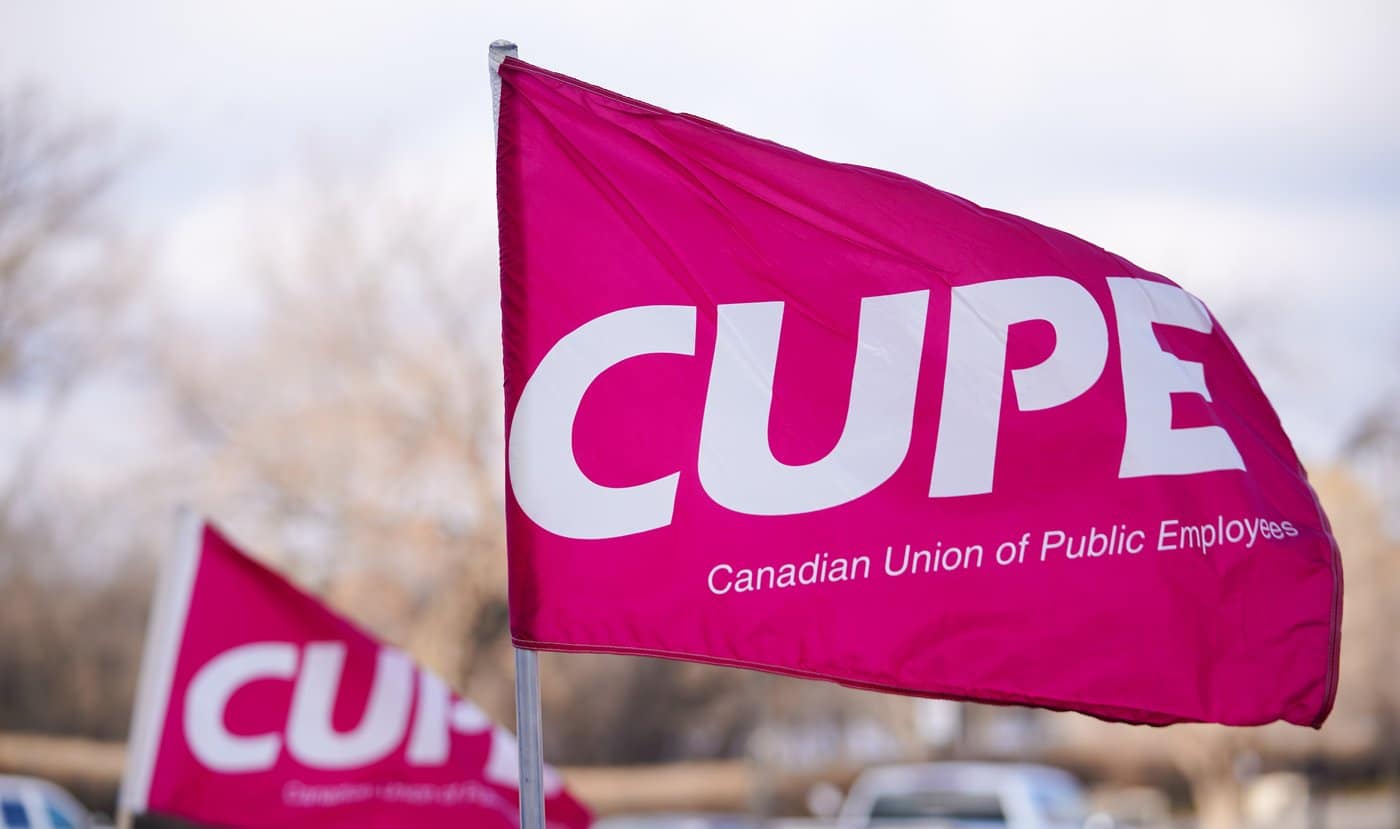 A Canadian Union of Public Employees (CUPE) flag during an education support workers rally outside of the Saskatchewan Legislative Building in Regina, Tuesday, Nov. 25, 2025. THE CANADIAN PRESS/Heywood Yu