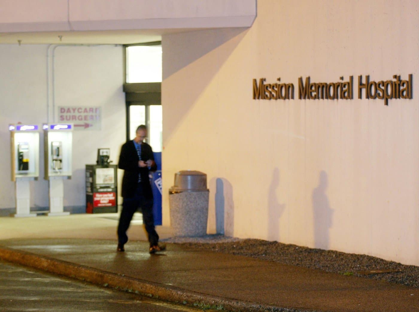 A man walks past the front doors of Mission Memorial Hospital in Mission, BC, Tuesday, May 20, 2003. (CP PHOTO/Richard Lam)