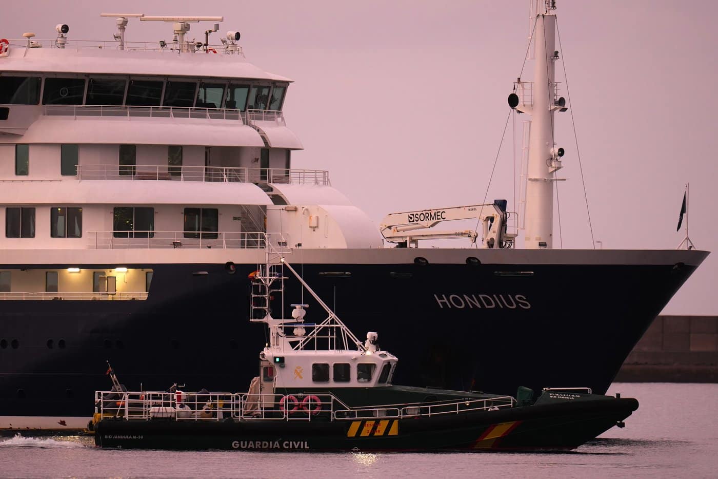 The hantavirus-stricken cruise ship MV Hondius is seen at anchor after arriving at the port of Granadilla in Tenerife, Canary Islands, Spain, on Sunday, May 10, 2026. (AP Photo/Manu Fernandez)