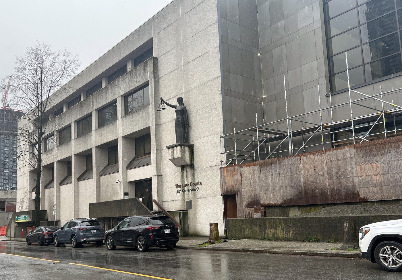 The B.C. Supreme Court building seen with plywood on it in New Westminster, B.C., on Wednesday, April 1, 2026. THE CANADIAN PRESS/Ashley Joannou