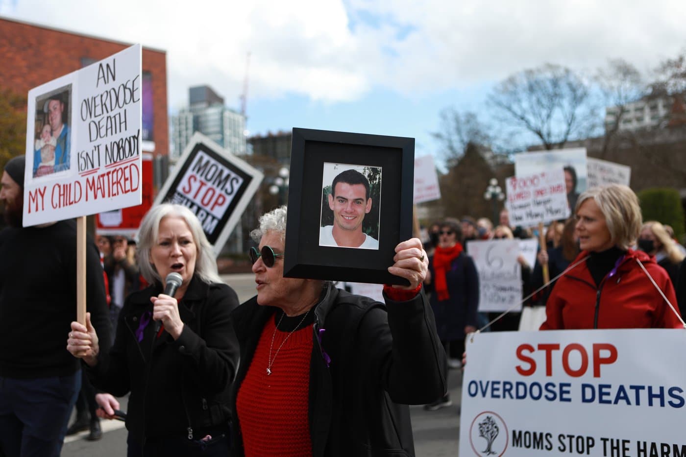 Moms Stop the Harm advocates and supporters march from Centennial Square to the Ministry of Health building on the sixth anniversary to mark the public health emergency of the declaration due to the significant increase in opioid-related overdose across the province during the Cut The Red Tape theme in Victoria, Thursday, April 14, 2022. THE CANADIAN PRESS/Chad Hipolito