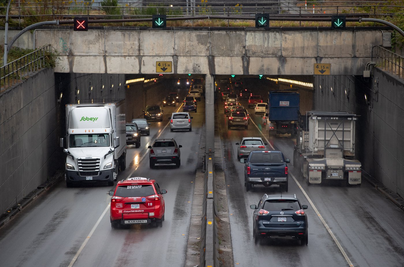 Motorists exit and enter the George Massey Tunnel in Richmond, B.C., on Friday, August 20, 2021. THE CANADIAN PRESS/Darryl Dyck