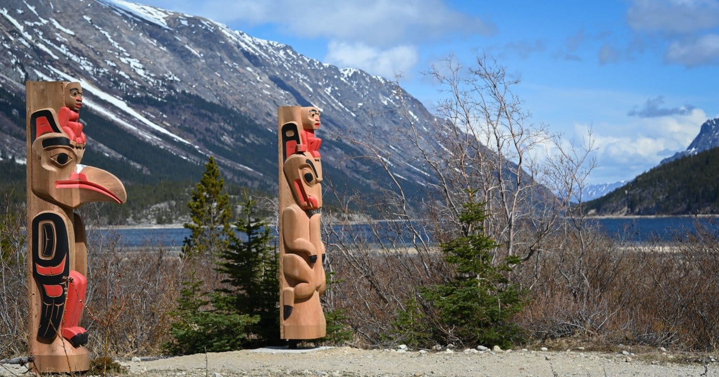 Two newly installed totem poles, shown in this undated handout photo, stand on either side of the Canadian end of the Chilkoot Trail in Bennett, B.C. The cedar poles represent the raven and the wolf, the two groups that encompass the six traditional clans of the Carcross/Tagish First Nation. THE CANADIAN PRESS/Handout — Max Leighton (Mandatory Credit)