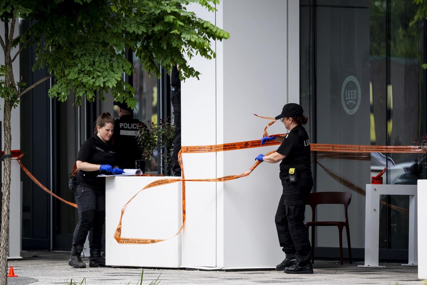 Montreal police work the scene of a shooting the day before, in Montreal on Tuesday, June 23, 2026. THE CANADIAN PRESS/Christopher Katsarov