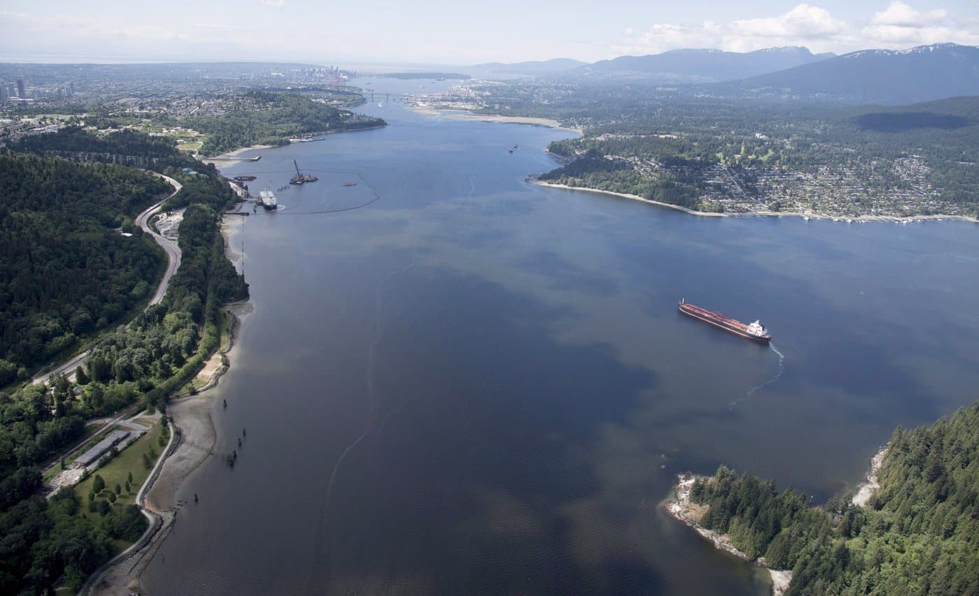An aerial shows an oil tanker anchored in Burrard Inlet just a short distance from Kinder Morgan's Trans Mountain marine terminal, top left, in Burnaby, B.C., is shown on Tuesday, May 29, 2018. THE CANADIAN PRESS Jonathan Hayward