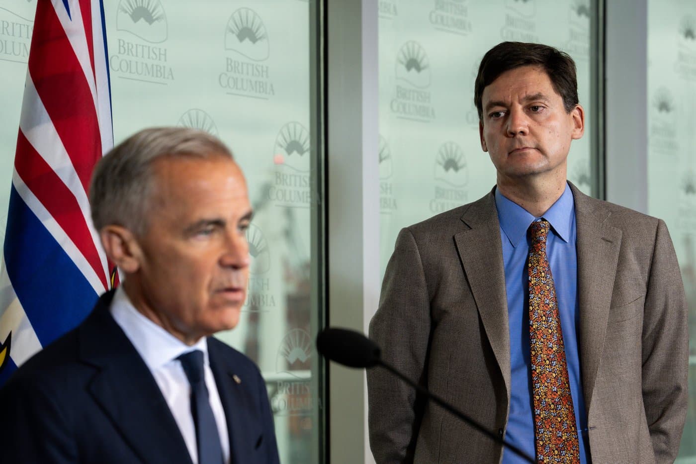 B.C. Premier David Eby watches as Prime Minister Mark Carney speaks during an announcement in Vancouver, on Thursday, July 2, 2026. THE CANADIAN PRESS/Ethan Cairns