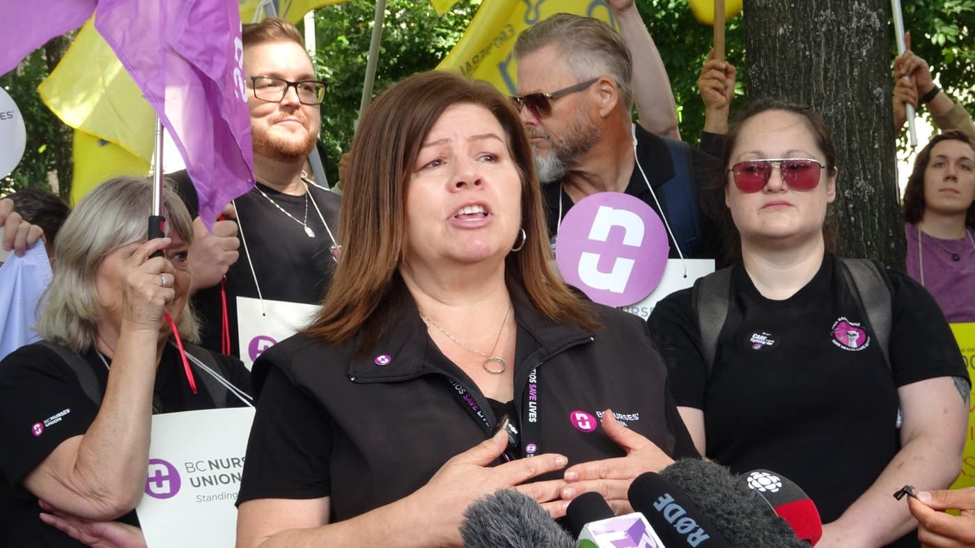 Adriane Gear, president of the BC Nurses' Union, speaks at a rally in front of Vancouver General Hospital on Tuesday, July 7, 2026. THE CANADIAN PRESS/Chuck Chiang