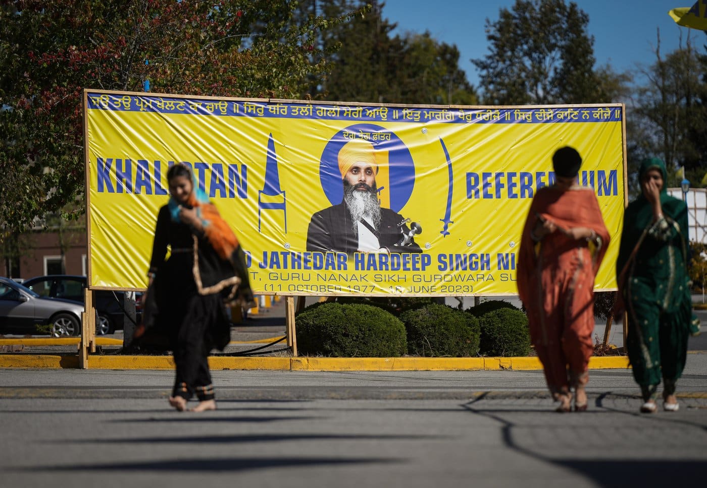 A photograph of late temple president Hardeep Singh Nijjar is seen on a banner outside the Guru Nanak Sikh Gurdwara Sahib, in Surrey, B.C., on Monday, Sept. 18, 2023. British Columbia's attorney general says the community is reeling over news that the Canadian government is investigating a link between the government of India and the death of a Sikh leader, although insiders say it's not a surprise. THE CANADIAN PRESS/Darryl Dyck