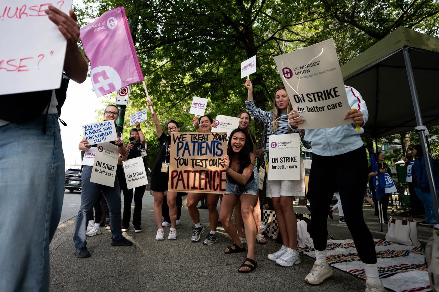 Members of the B.C. Nurses' Union participate in job action outside of Vancouver General Hospital in Vancouver, on Tuesday, July 7, 2026. THE CANADIAN PRESS/Ethan Cairns