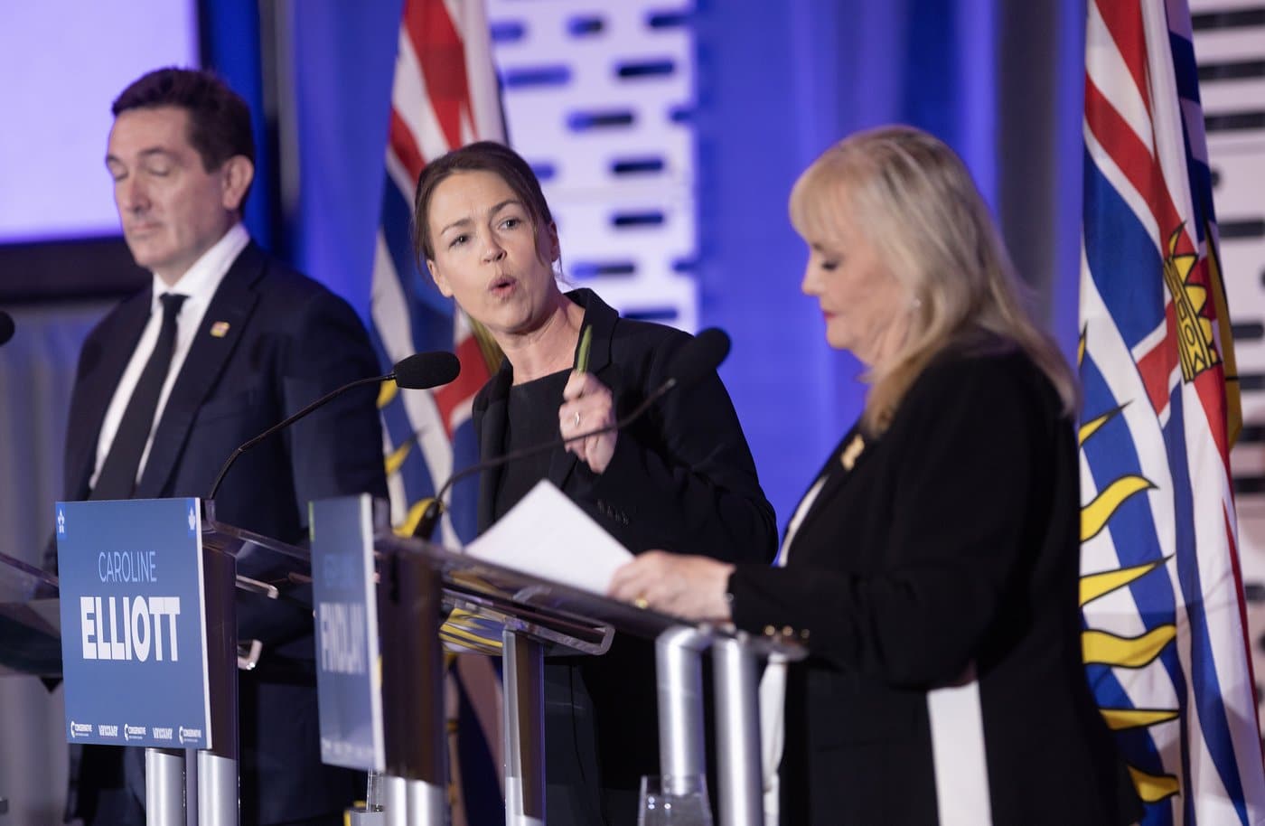 B.C. Conservative leadership candidate Caroline Elliott speaks as fellow candidates Yuri Fulmer, left, and Kerry-Lynne Findlay look on during a debate at the Canada Strong and Free Network conference in Vancouver on Friday, April 24, 2026. THE CANADIAN PRESS/Chad Hipolito
