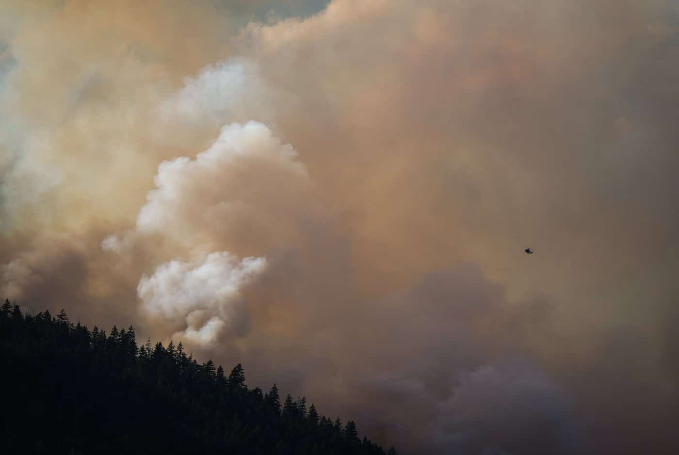 A helicopter is used to survey the Brunswick Creek wildfire in Boston Bar, B.C., on Thursday, July 9, 2026. THE CANADIAN PRESS/Darryl Dyck