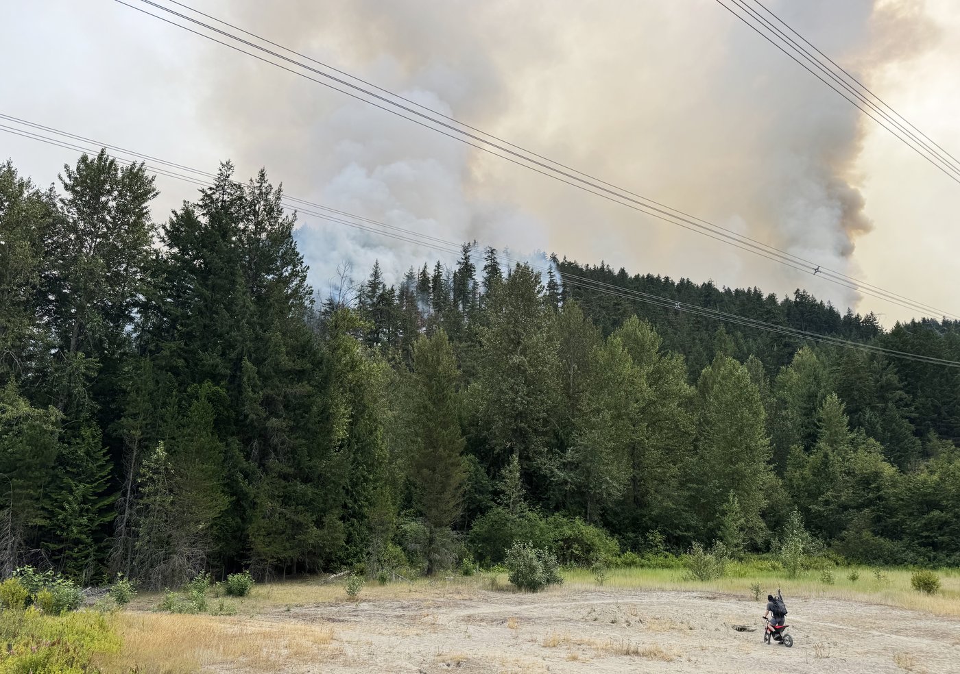 Smoke from the Signal Hill fire rises outside the Village of Pemberton, B.C., on Thursday, July 16, 2026. THE CANADIAN PRESS/Brenna Owen
