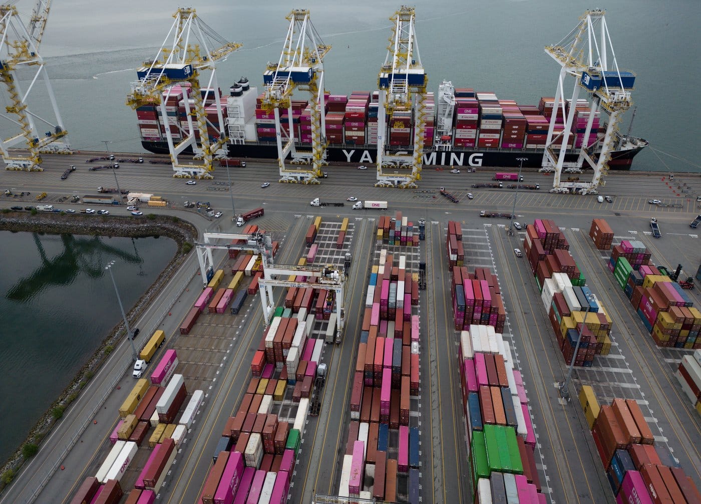 Containers are unloaded from the Yang Ming Throne container ship at Deltaport, at Roberts Bank in Delta, B.C., on Thursday, July 16, 2026. The federal government announced that upgrading the Port of Vancouver has been referred to Canada's Major Projects Office for possible fast-tracking. The upgrades include Roberts Bank Terminal 2, a proposed three-berth terminal that would increase the port's container capacity by 50 per cent and expanding capacity of bulk terminals through land use and infrastructure improvements. THE CANADIAN PRESS/Darryl Dyck