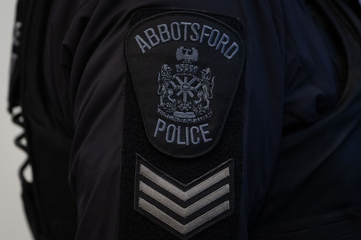 An Abbotsford Police patch is worn by an officer at RCMP "E" Division headquarters in Surrey, B.C., on Thursday, Feb. 19, 2026. THE CANADIAN PRESS/Ethan Cairns