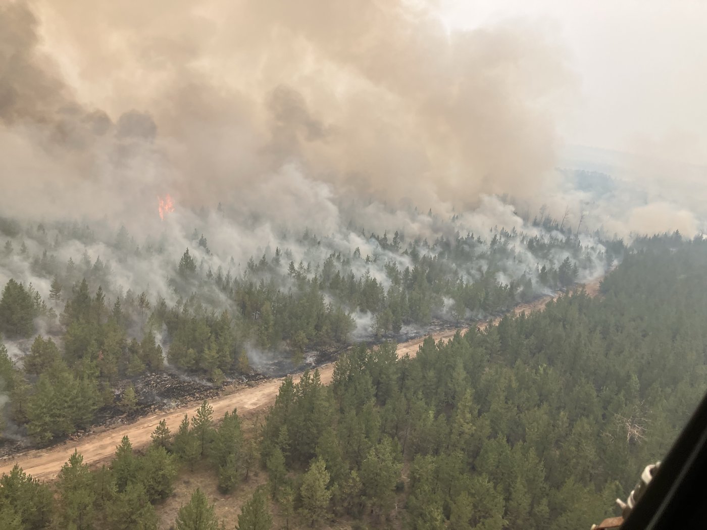 Firefighting crews conduct ignition operations in response to the Fiftynine Creek wildfire northwest of Clinton, B.C., in this handout photo, on Tuesday, July 21, 2026. THE CANADIAN PRESS/Handout — BC Wildfire Service (Mandatory Credit)