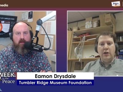Two people recording a podcast