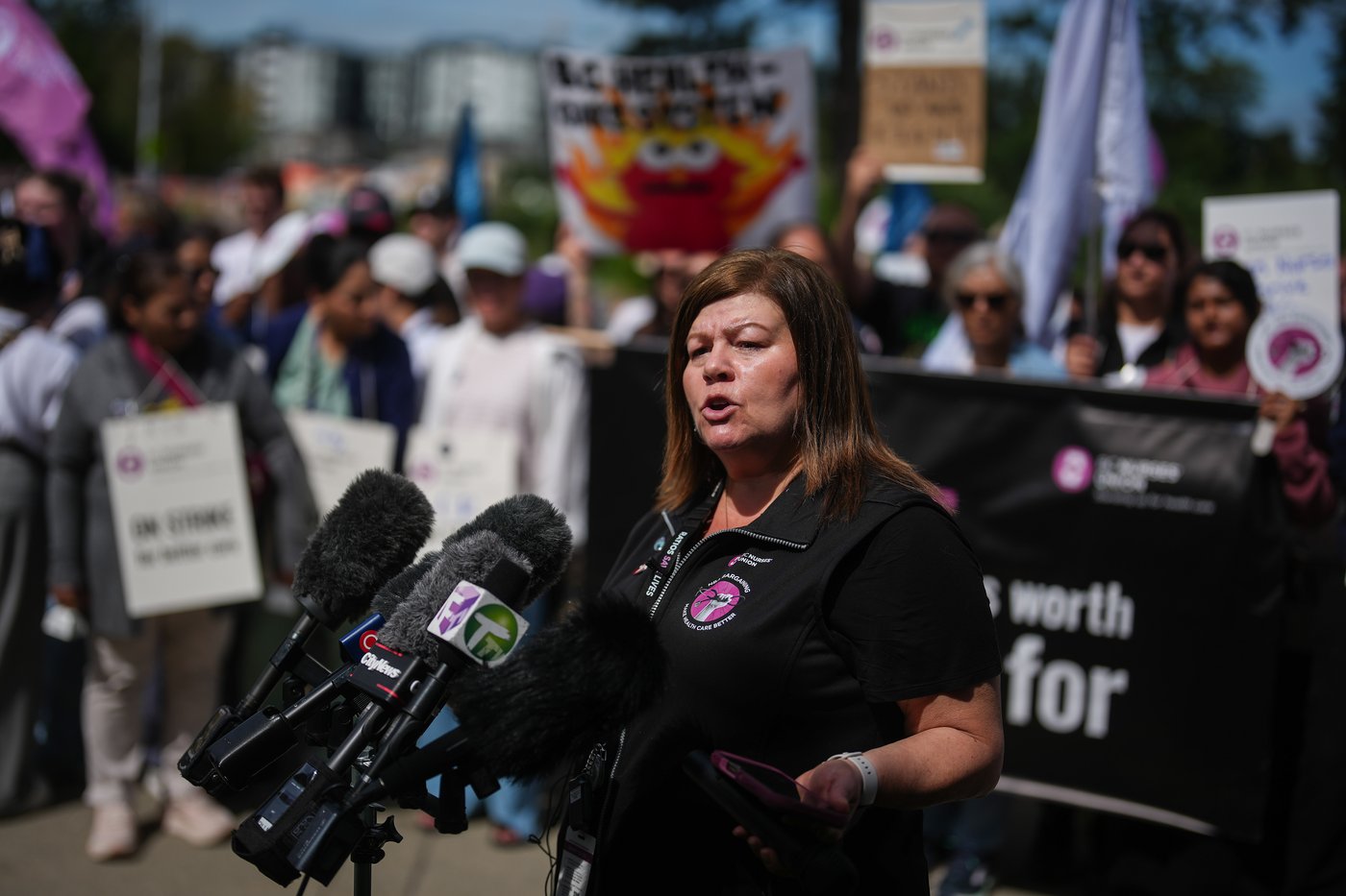 BC Nurses' Union president Adriane Gear speaks as union members picket outside Surrey Memorial Hospital, in Surrey, B.C., on Thursday, July 9, 2026. THE CANADIAN PRESS/Darryl Dyck