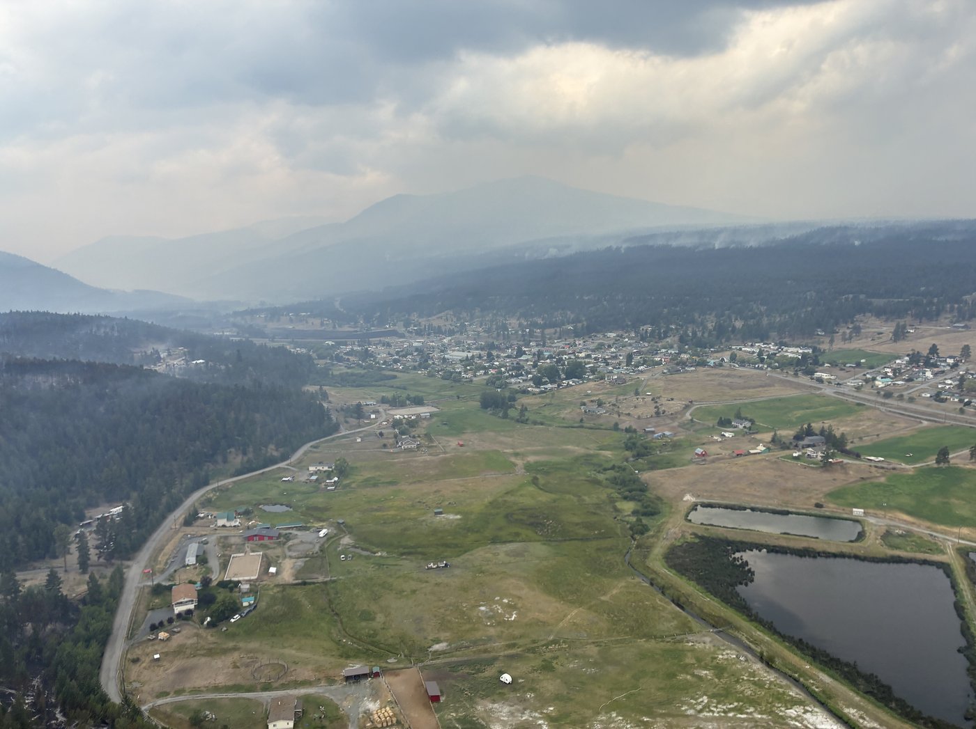 A photograph that the BC Wildfire Service says was taken on Monday, July 27, 2026, shows the village of Clinton, B.C., with the northern parts of the community appearing unscathed, three days after an advancing wildfire forced residents to evacuate. THE CANADIAN PRESS/Handout — BC Wildfire Service (Mandatory Credit)